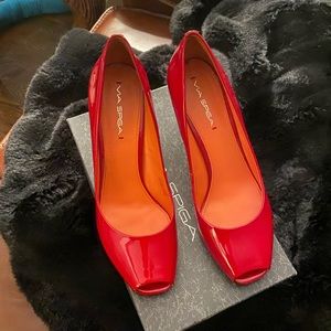 Red Via Spiga peep toe pumps.